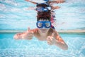 Boy in mask dive in swimming pool Royalty Free Stock Photo