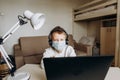 Boy mask learning online lesson technology laptop Royalty Free Stock Photo