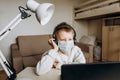 Boy mask learning online lesson technology laptop Royalty Free Stock Photo