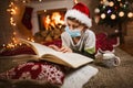 Boy meets Christmas in the covid-19 pandemic. Child in a protective medical mask. Quarantine isolation social distance.