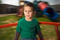 Boy on merry go round Royalty Free Stock Photo