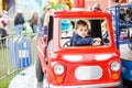 Boy on a Merry-Go-Round Firetruck Royalty Free Stock Photo