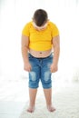 A boy with metabolic disorders. Child with the problem of childhood obesity. Overweight obese fat boy.