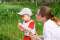 Boy with mother and dandelion Royalty Free Stock Photo