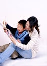 Boy and mother reading together