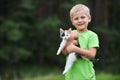 Boy with motley cat Royalty Free Stock Photo