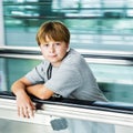 Boy on moving staircase Royalty Free Stock Photo