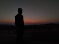 A boy narrating sunset colors silhouette