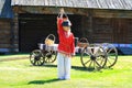 Boy in national Russian costume on village courtyard