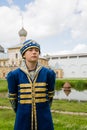Boy in national russian suit on the Kremlin Rostov Great