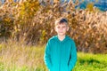 A boy in nature poses for the camera