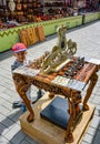 A boy near a chess table in the Vernissage market, in the center of Yerevan. Here you can buy a wide variety of products