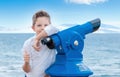 Boy near the scoping public binocular telescope binoscope near Royalty Free Stock Photo