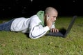 Boy with notebook and cell phone in park Royalty Free Stock Photo