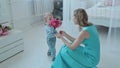 Boy offering bunch flowers for mother