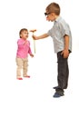 Boy offering flower to small girl Royalty Free Stock Photo