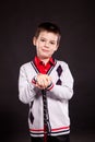 Boy in official dresscode with a putter