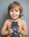 Boy with an old camera Royalty Free Stock Photo