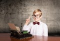 Boy with the old typewriter Royalty Free Stock Photo