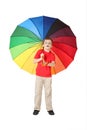 Boy opened mouth with multicolored umbrella Royalty Free Stock Photo