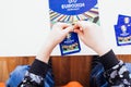 Boy opening stickers for EURO2024 album by Topps