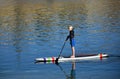 Boy on paddleboard in Dana Point Harbor, California.