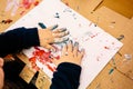 Boy with paint stained hands