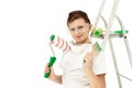 A boy with painting tools on a white background. Construction tools. Roller and stepladder