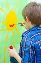 Boy painting on the wall Royalty Free Stock Photo