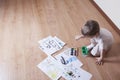 Boy Painting With Watercolors And Paintbrush