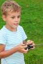 Boy with panel for radio control in hands