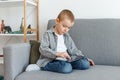 Boy without parental control wasting time playing games