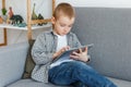 Boy without parental control wasting time playing games