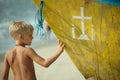 Boy with part of a boat Royalty Free Stock Photo