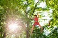 Boy pass difficult climbing bridge at rope park Royalty Free Stock Photo