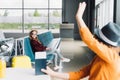 Boy with passport and air ticket waving at preteen kid in waiting hall Royalty Free Stock Photo