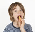 Boy with peanut flips in the mouth Royalty Free Stock Photo