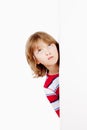 Boy Peeking Out From Behind A White Board Looking Up Royalty Free Stock Photo