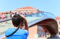 Boy photographs the bridge called Ponte della Costituzione that