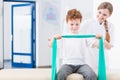 Boy and physical therapy in clinic Royalty Free Stock Photo