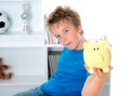 Boy with piggy-bank Royalty Free Stock Photo