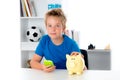 Boy with piggy-bank and phone