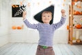 Boy in a pirate costume celebrates Halloween at home. Royalty Free Stock Photo