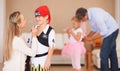 Boy, pirate costume and halloween with mother in home, face paint and happiness in childhood. Son, smile and house