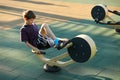 Boy with a plaster cast trying to workout