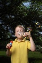 Boy play in bubbles Royalty Free Stock Photo