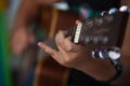 Boy play chords on guitar. Royalty Free Stock Photo