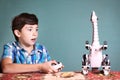 Boy play with dinosaur toy by remote control pult Royalty Free Stock Photo