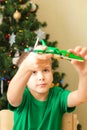 Boy play with pterodactyl made from plastic blocks