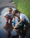 2 boy play in puddle summer day Royalty Free Stock Photo